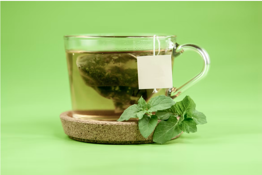 A glass cup of green tea